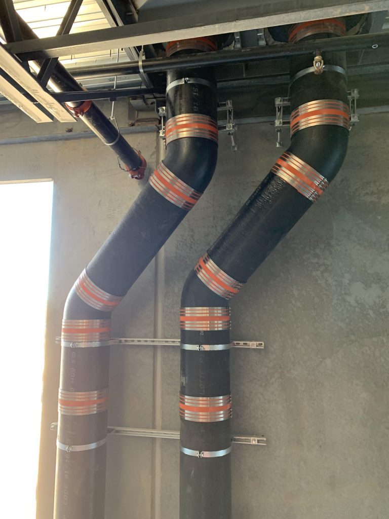 Building pipes with black and orange stripes.