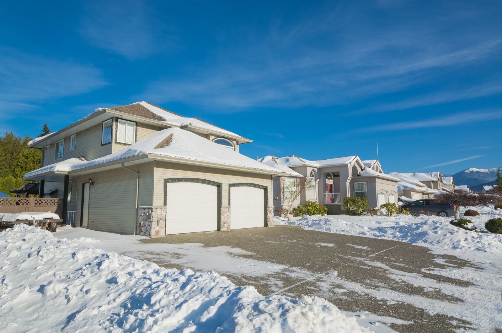 A snowy Utah driveway featuring a snow melt system designed to efficiently remove ice and snow for safe access.